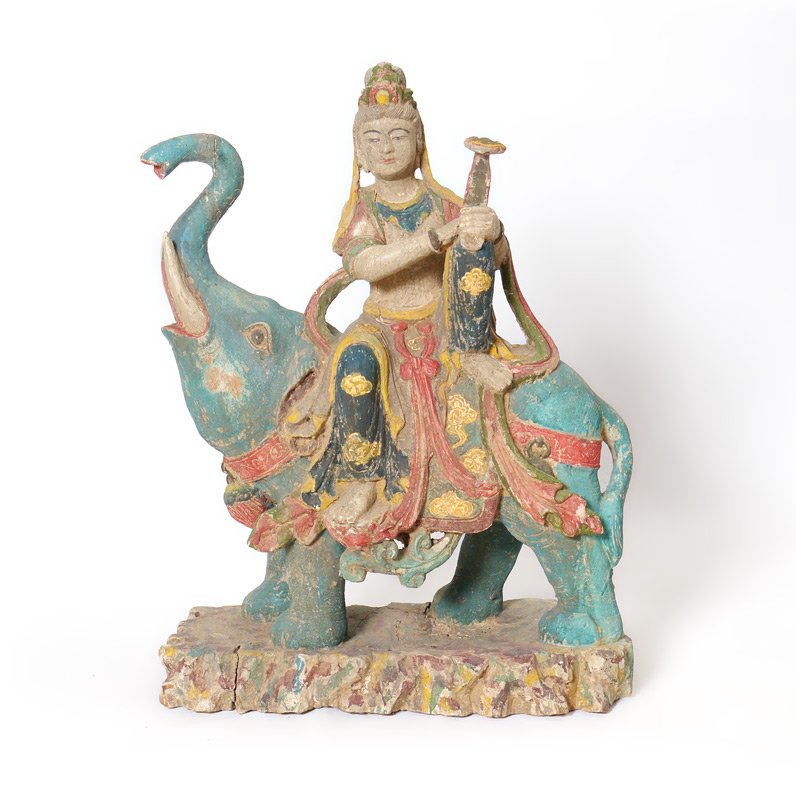 SINO-TIBETAN CARVED POLYCHROME ELEPHANT RIDER: SINO-TIBETAN CARVED POLYCHROME ELEPHANT RIDER: Large Sino-Tibetan carved figure of Quanyin with scepter, on the back of a trumpeting elephant naturalistic base. 30'' h. x 27'' x 10''.