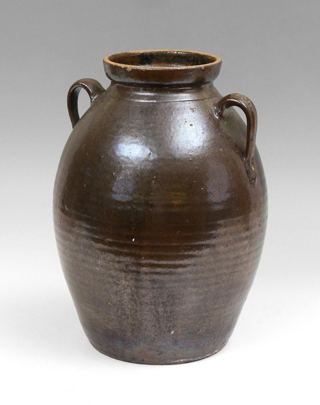 JESSE BRADFORD LONG GEORGIA STONEWARE JAR: JESSE BRADFORD LONG GEORGIA STONEWARE JAR: Double handled brown alkaline glaze 4 gallon jar, impressed signature JBL on handle. Jesse Bradford Long operated during the Civil War era out of Crawford Co