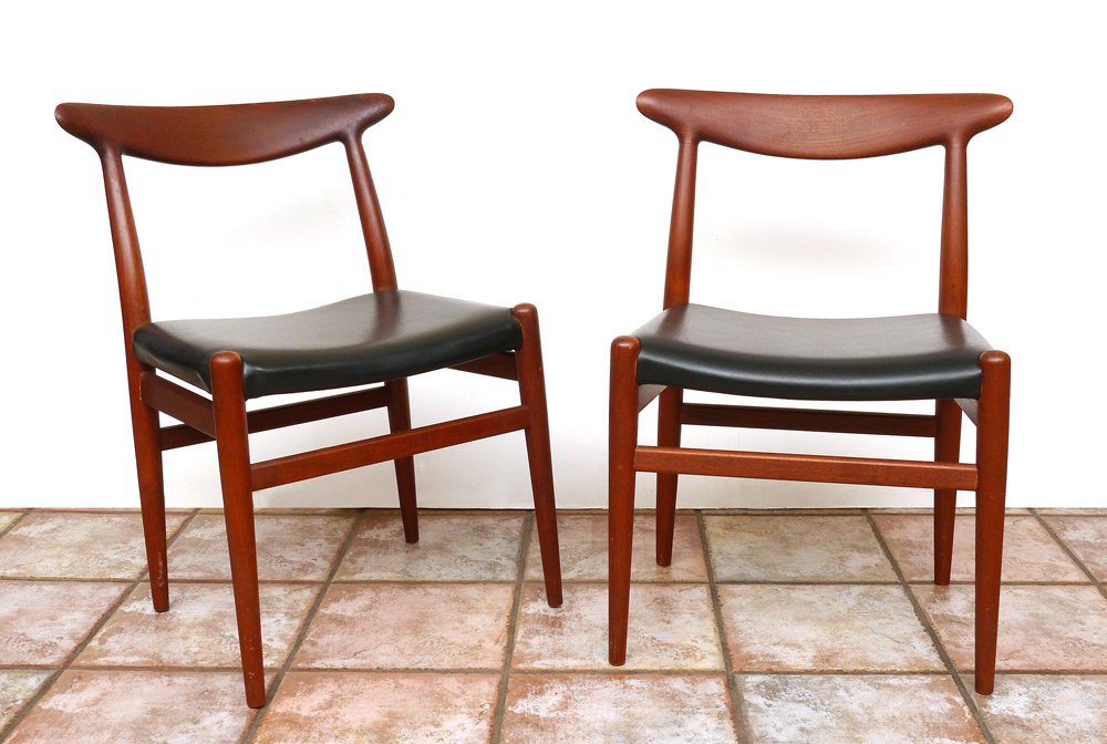 PAIR HANS WEGNER TEAK SIDE CHAIRS: PAIR HANS WEGNER TEAK SIDE CHAIRS: Hans Wegner for CM Madsens side chairs with black leather upholstery. Brand mark, overall measure 30" h. x 21 3/4" x 18 1/2".