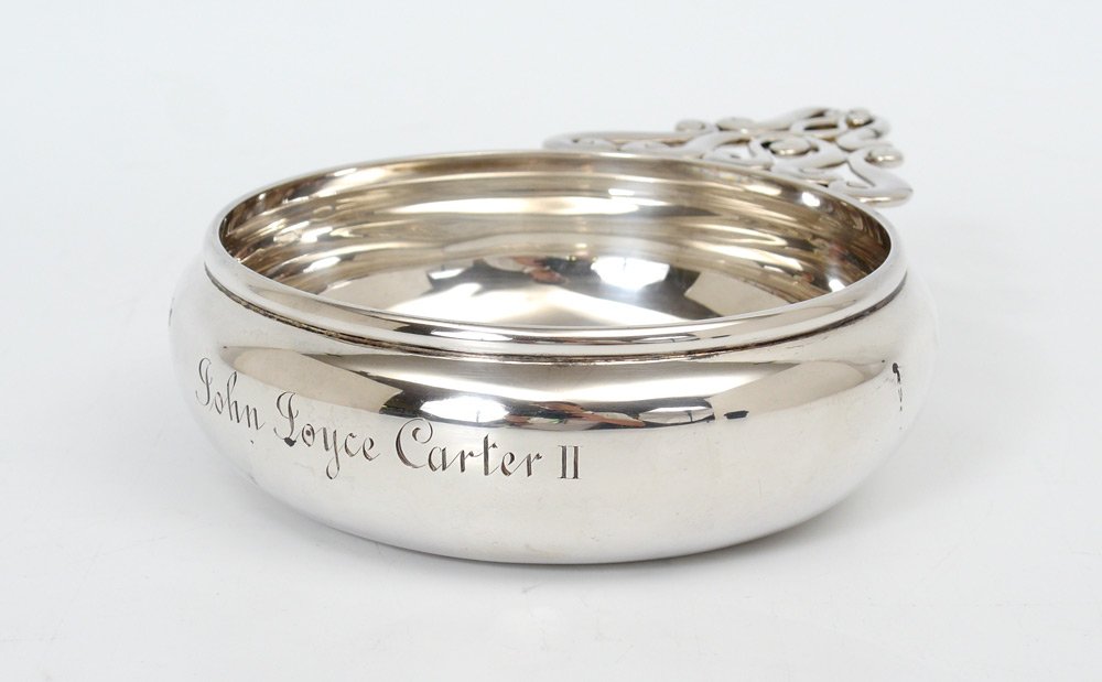 TIFFANY & CO STERLING PORRINGER: TIFFANY & CO STERLING PORRINGER: Scrolling open work handle, monogrammed on side John Joyce Carter II. Marked on base "Tiffany & Co., 12755A Makers 7009, Sterling Silver, 925-1000, M, 3 Gills. Measure