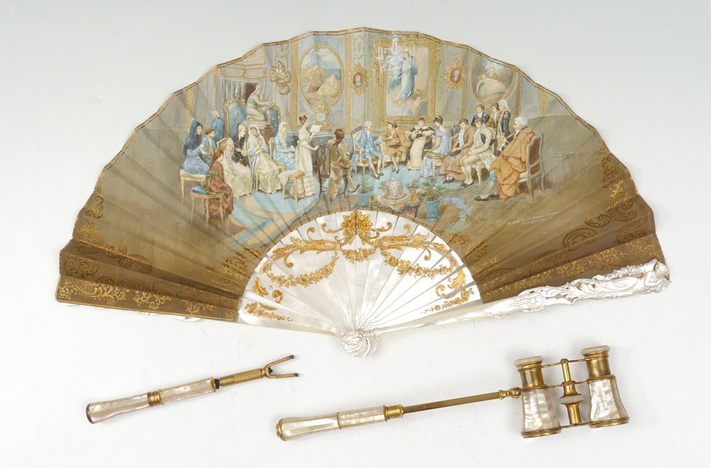 HAND PAINTED MOTHER OF PEARL FAN & OPERA GLASSES: HAND PAINTED MOTHER OF PEARL FAN & OPERA GLASSES: To include 1) Fan with mother of pearl blades with carved cherub figures, gilt foliate decoration. Hand painted silk with interior genre scene titled