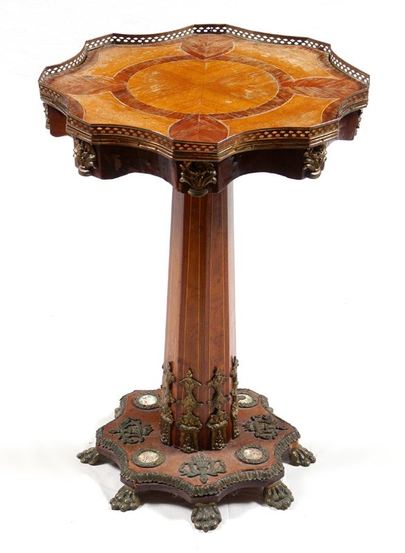 FRENCH INLAID ORMOLU SIDE TABLE: FRENCH INLAID ORMOLU SIDE TABLE: Pierced brass gallery on shaped top with parquetry inlay, shaped skirt with applied ormolu accents. Pedestal body with string inlay, applied ormolu decoration at and o