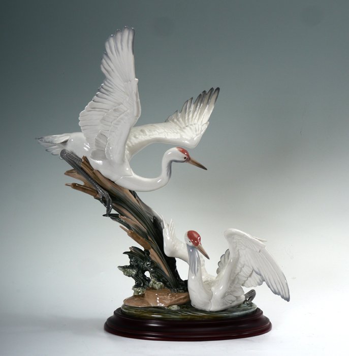 LLADRO PORCELAIN FIGURE CRANES 1456: LLADRO PORCELAIN FIGURINE: CRANES #1456, Salvador Debon sculptor, issued 1983. Approx. 19.5''h. x 17.5'' x 13'', plus wooden stand.