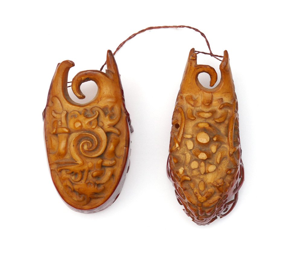 DAYAK CARVED HORNBILL BIRD EAR WEIGHTS: DAYAK CARVED HORNBILL BIRD EAR WEIGHTS: From the Dayak tribe of Borneo, used to slowly stretched pieced holes in the lobes to a large diameter. 2 separate weights, one more profusely carved than the o