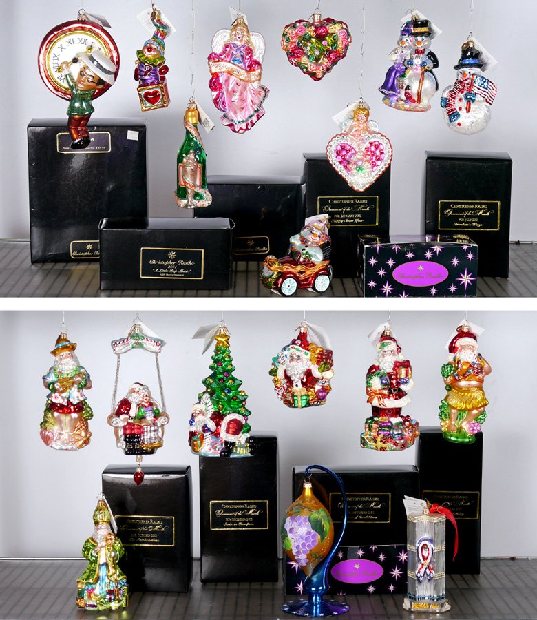 CHRISTOPHER RADKO ORNAMENTS 19 PC: ESTATE COLLECTION OF CHRISTOPHER RADKO ORNAMENTS: 18 ornaments and one blown glass stand. Several traditional Santa motifs, tropical Santa figures, Snowmen, New Year's, hearts, Twin Towers, etc. Sold 