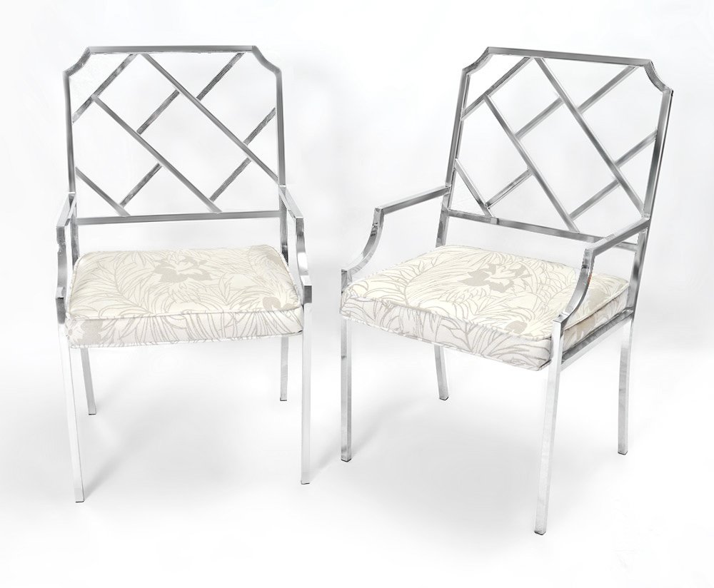 MILO BAUGHMAN CHROME CHIPPENDALE STYLE CHAIRS: PAIR MILO BAUGHMAN FOR DESIGN INSTITUTE OF AMERICA CHIPPENDALE STYLE CHAIRS: A pair of Chines Chippendale style open arm chairs, chrome with upholstered seats. Measures approx. 38"h. x 21 1/2" x 19".