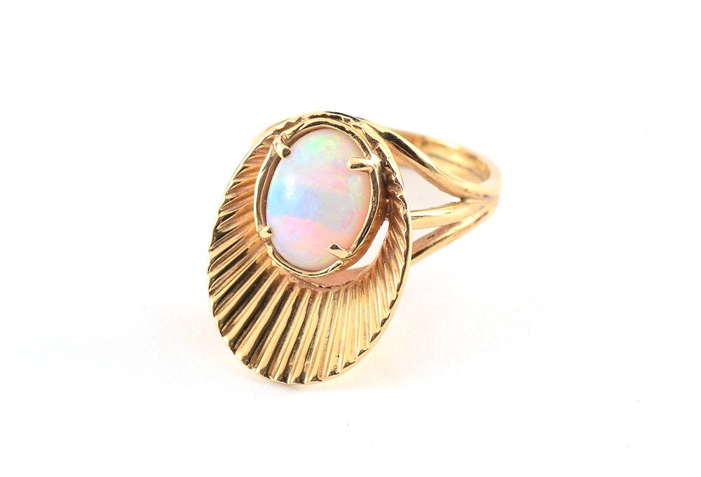 RETRO 14K GOLD OPAL RING SZ 5.75: RETRO OPAL RING: 14K yellow gold fan ring with a solitaire 1.70 Ct cabochon opal, 10 mm. oval. Size 5.75. Weight 5.7 grams.