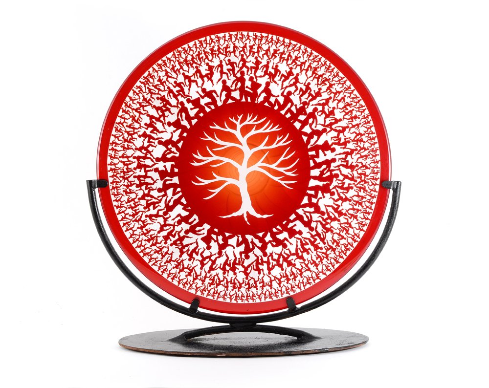 DUNCAN McCLELLAN 50TH COUSIN ART GLASS CHARGER: McCLELLAN, Duncan, (American, 20th Century): ''50th Cousin'' series art glass charger, red glass ground with tree center and figures encircling rim, stylized sun verso. Signed, approx. 18 1/2'' dia.,
