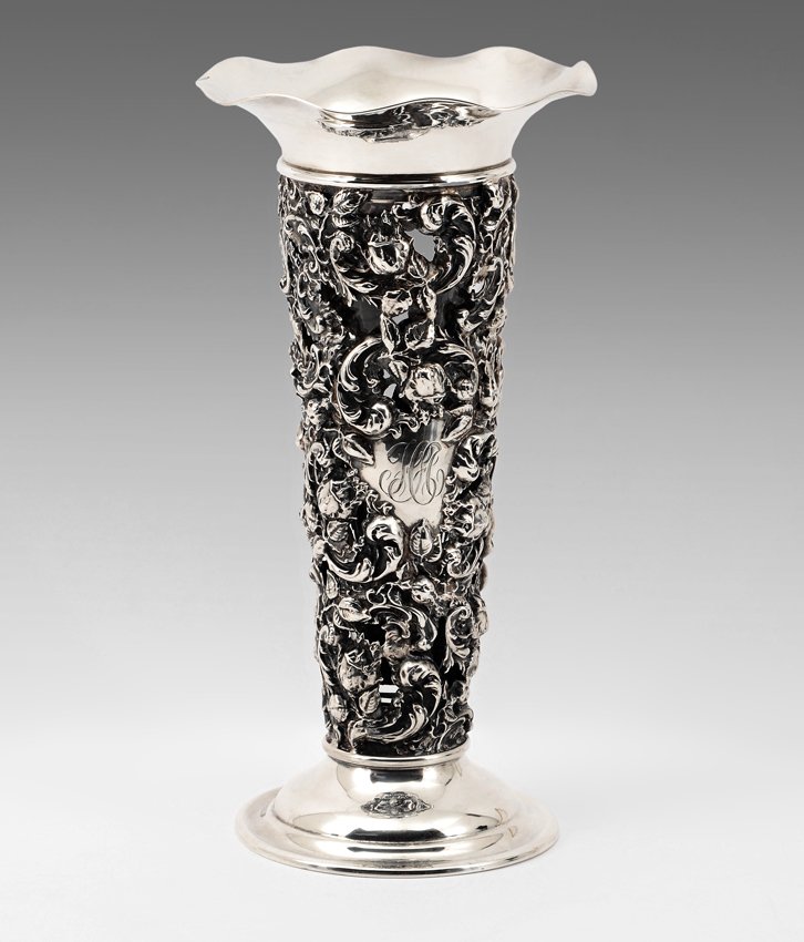MAUSER EMBOSSED & PIERCED FLORAL STERLING VASE: MAUSER EMBOSSED & PIERCED FLORAL STERLING VASE: Ruffled rim, body with ornate pierced and embossed floral decoration, monogrammed in medallion. Base marked with Mauser mark, Sterling, 925/1000 Fine, 1