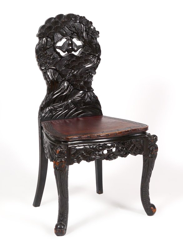 HEAVILY CARVED BLACK LACQUER CHINESE SIDE CHAIR: HEAVILY CARVED BLACK LACQUER ELM CHINESE SIDE CHAIR: Profusely carved all over with black lacquer ebonized finish. Back with foliate and swallow in open medallion motifs, wood seat with geometric desi