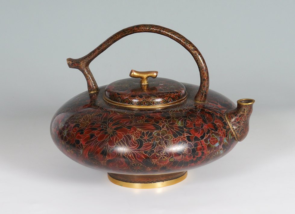 CHINESE CLOISONNE TEA POT: CHINESE CLOISONNE TEA POT: Oversized hot water kettle, dark toned floral motif on brass, overall measures 12" h. x 16".