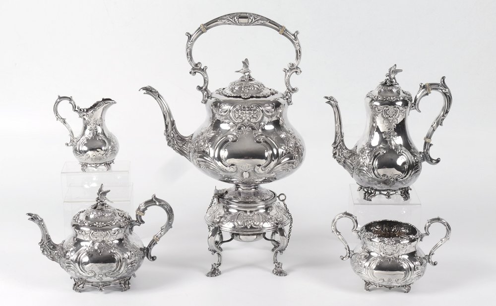 5 PIECE ORNATE ENGLISH STERLING TEA SERVICE: 5 PIECE ORNATE ENGLISH STERLING SILVER TEA SERVICE: An assembled collection with a matching floral repousse motif to include 1) 1896 Charles Lamb, Dublin, hot water kettle on stand. Hinged lid with ea