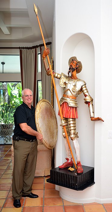 LIFE SIZE SPANISH OURO DON QUIXOTE SCULPTURE: LIFE SIZE SPANISH OURO DON QUIXOTE SCULPTURE: Polychrome carved wood life size sculpture of Don Quixote holding a spear, with a shield. Marked on base Ouro Espana on a scroll, statue overall measures 