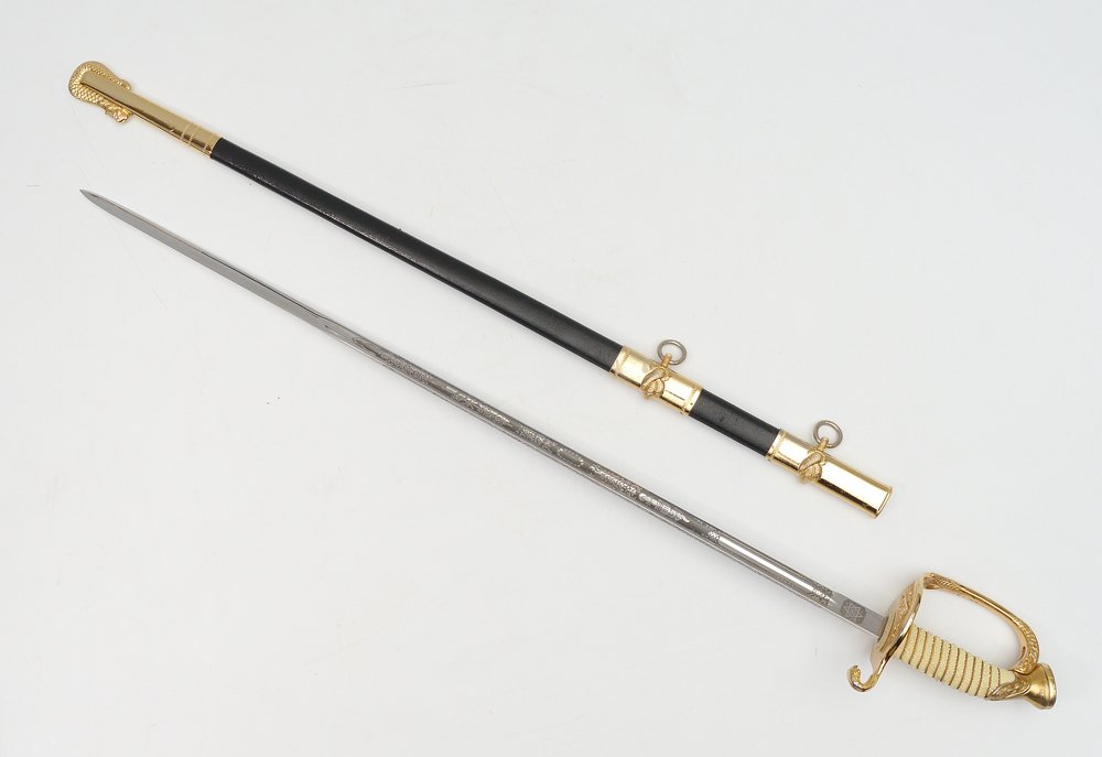 VIETNAM ERA MODEL 1850 NAVAL OFFICERS SWORD: VIETNAM ERA MODEL 1850 NAVAL OFFICERS SWORD: Gilt metal guard, shagreen style grip with gold twist wire, mint N. S. Meyer etched blade 24 3/4'' blade, not presented. Leather over metal scabbard with g