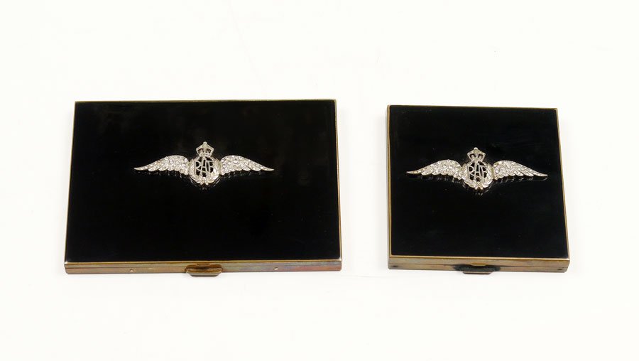 VOLUPTE ROYAL AIR FORCE COMPACT & CIGARETTE CASE: VINTAGE VOLUPTE ROYAL AIR FORCE INSIGNIA COMPACT AND CIGARETTE CASE: Black enameled gold tone with the applied RAF wing insignia on the hinged cover of both the mirrored compact and the cigarette case