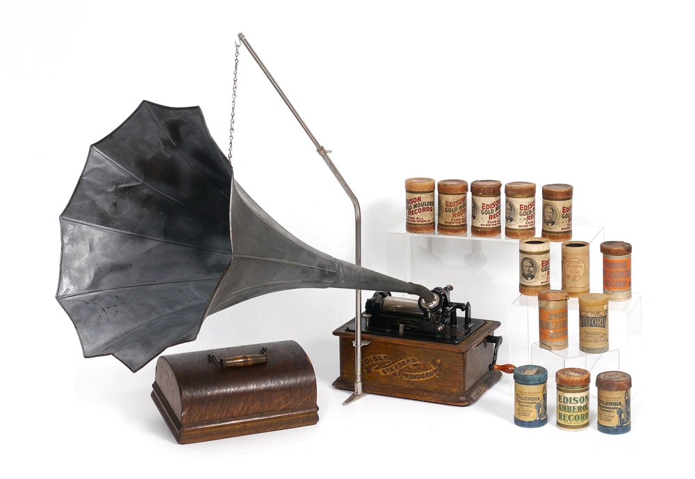 EDISON STANDARD PHONOGRAPH WITH CYLINDERS: EDISON STANDARD PHONOGRAPH WITH CYLINDERS: Oak case, serial number S69377, last patent date of 1898. Sold with reproducer, original horn (32" long x 18" dia), horn stand, and 13 cylinders. Overall mea