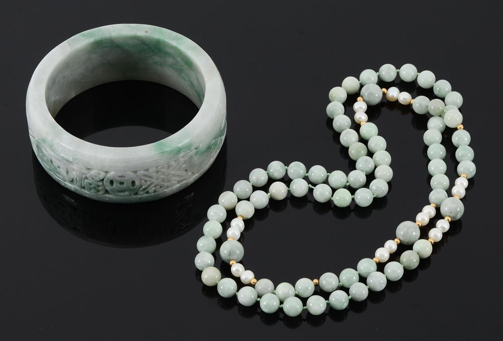 JADEITE JADE BRACELET & 32" BEAD NECKLACE: ESTATE FRESH JADEITE JADE BANGLE BRACELET AND BEADS: 1) Continuous strand bead necklace of jadeite beads, 8-10mm, with 8 pearl spacers 5 mm. Measures 32" length. 2) A substantial carved bangle bracele