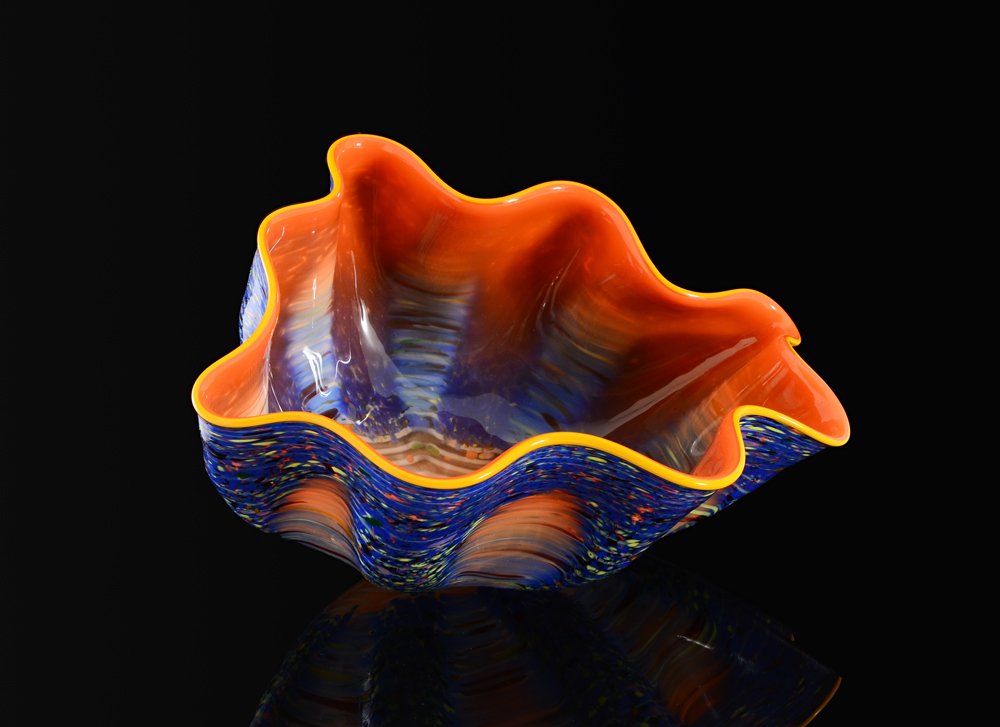 DALE CHIHULY ALLA MACCHIA BLOWN GLASS BOWL: CHIHULY, Dale, (American, 1941-): Blown glass ''alla MACCHIA'' bowl, vibrant orange interior, mottled blue exterior, signed on base. In pristine condition, sold with original book with photograph of t