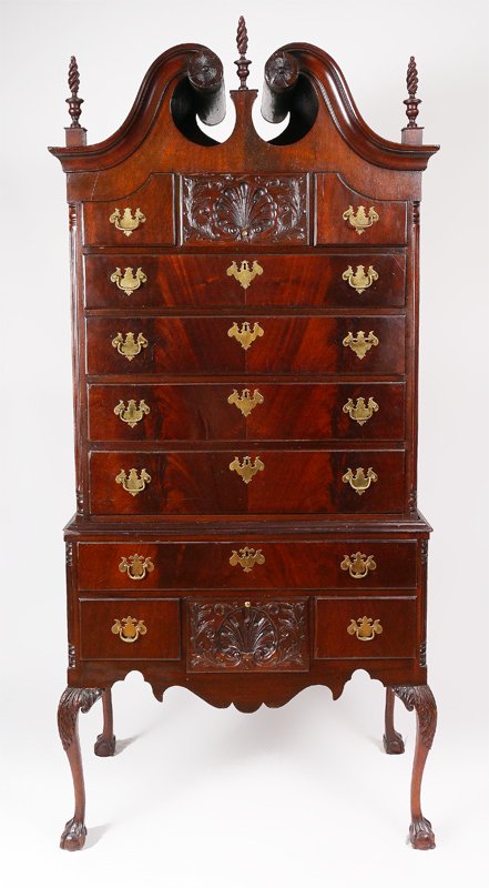19TH CENTURY MAHOGANY CHIPPENDALE STYLE HIGHBOY: 19TH CENTURY MAHOGANY CHIPPENDALE STYLE HIGHBOY: Mid 19th century, flame mahogany veneer all over. Broken arch pediment with rosettes, 2 spire finials. Top central drawer with carved shell front surmo