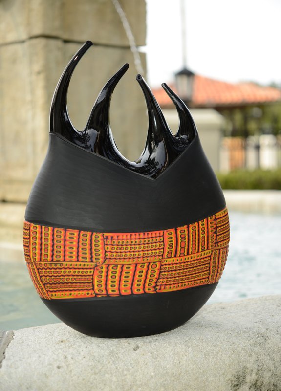 MURANO MASSIMILIANO SCHIAVON ART GLASS SCULPTURE: MURANO MASSIMILIANO SCHIAVON ART GLASS SCULPTURE: Free form black glass vase with ribbed band of orange, reds. black and yellow mosaic designs. Signed on base "Schiavon, M." and titled "Under the Brid