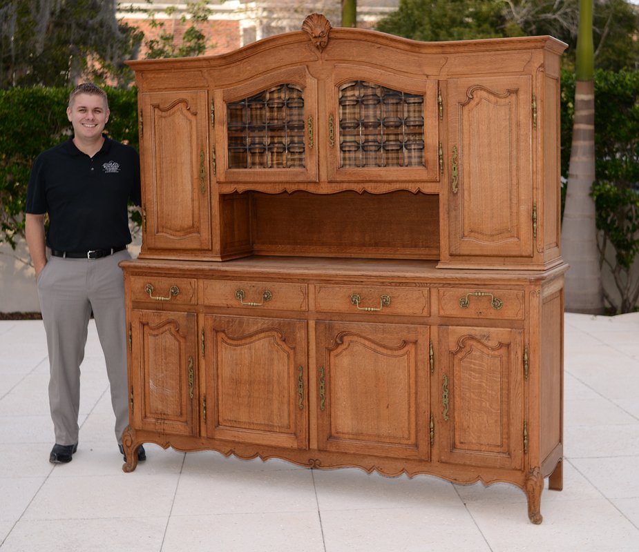COUNTRY FRENCH SIDEBOARD CURIO: COUNTRY FRENCH SIDEBOARD CURIO: Shaped pediment with applied shell carved decoration, top 2 central glass doors, 2 side doors. Base with 4 drawers over 4 doors, shaped skirt, carved and shaped front l