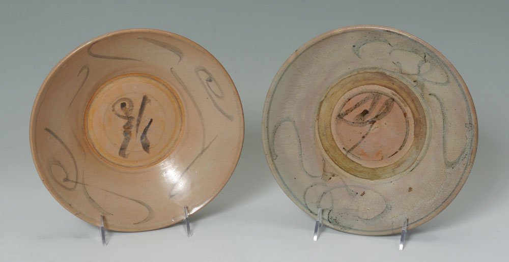 2 CHINESE BLUE DECORATED BOWLS: 2 CHINESE BLUE DECORATED BOWLS: 2 earthenware low bowls with stylized blue decoration, no visible marks, 2 1/4'' h. x 9 1/4'' dia. Actual age unknown.