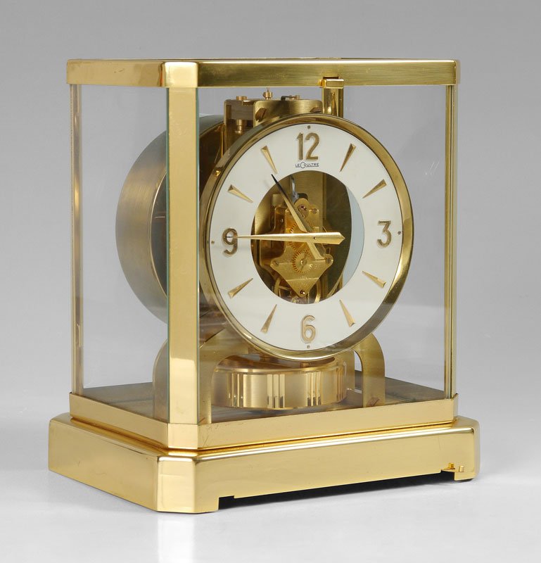 1960'S LECOULTRE ATMOS CLOCK: 1960'S LECOULTRE ATMOS CLOCK: Late 1960s production, serial number 269036, brass case, glass sides and top. White enamel dial marked LeCoultre, overall measures 9 1/4'' h. x 8 1/4'' x 6 1/4''. Sold wi