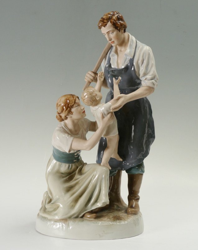 ROYAL DUX BLACKSMITHS FAMILY FIGURAL GROUP: ROYAL DUX BLACKSMITHS FAMILY FIGURAL GROUP: 3 figure group with blacksmith, mother and child, marked on base with triangle mark, ''Royal Dux'', impressed 11559, 67, Made in Czechoslovakia. 24 1/4'' h.