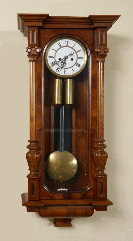 AUSTRIAN DOUBLE WEIGHT WALL REGULATOR CLOCK: AUSTRIAN DOUBLE WEIGHT WALL REGULATOR CLOCK: Walnut case, carved and fluted half column decoration, porcelain dial with Roman numerals. Double weight time and strike movement. Overall measures 37 1/2'
