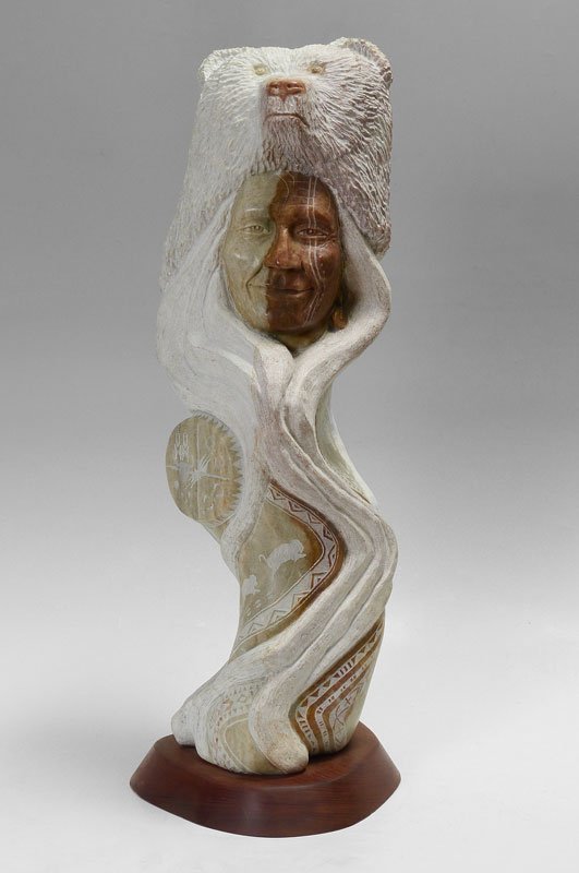 KATHY WHITMAN CARVING OF A BEAR HEAD: WHITMAN, Kathy ''Elk Woman'', (Mandan, Hidatsa & Arikara) Elk Woman Carving w/Bear Head, overall measures 32'' h. including 10'' base x 12'' base dia.