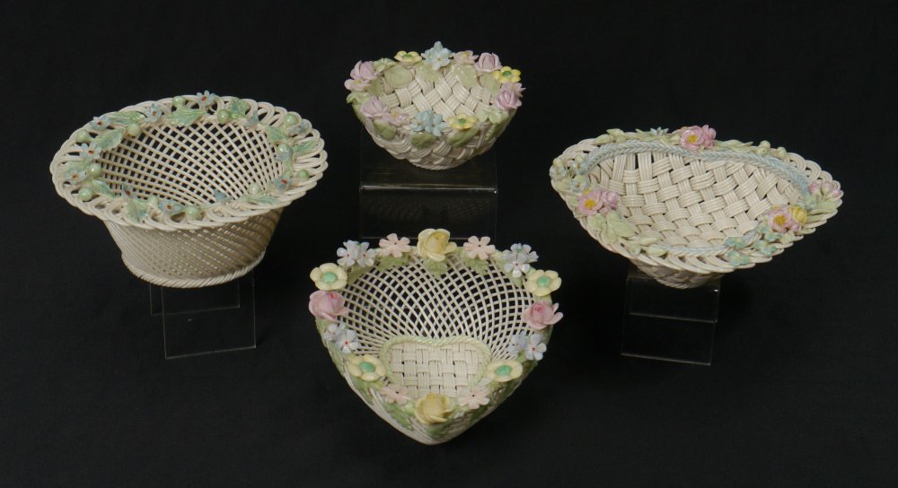 4 IRISH BELLEEK PORCELAIN BASKETS: 4 IRISH BELLEEK PORCELAIN BASKETS: 1) The petite little Bird's Nest, 2" x 4" dia. 2) Heart, 2 /12" x 5" x 6". 3) Erne, 2 1/2" x 6 1/2". 4) Small round basket with blue flowers, 2 1/2" x 6". All are 4