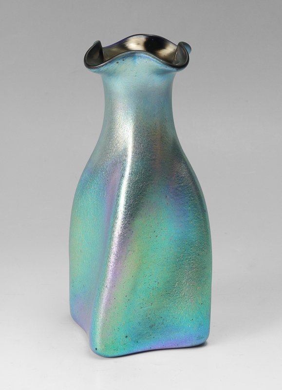 KRALIK GLATT SILBERIRIS IRIDESCENT ART GLASS VASE: KRALIK GLATT SILBERIRIS IRIDESCENT ART GLASS VASE: Unsigned, squared vase with slight twist, flared and scalloped rim. Iridescent blue glass, overall measures 9 1/4" h. x 4".