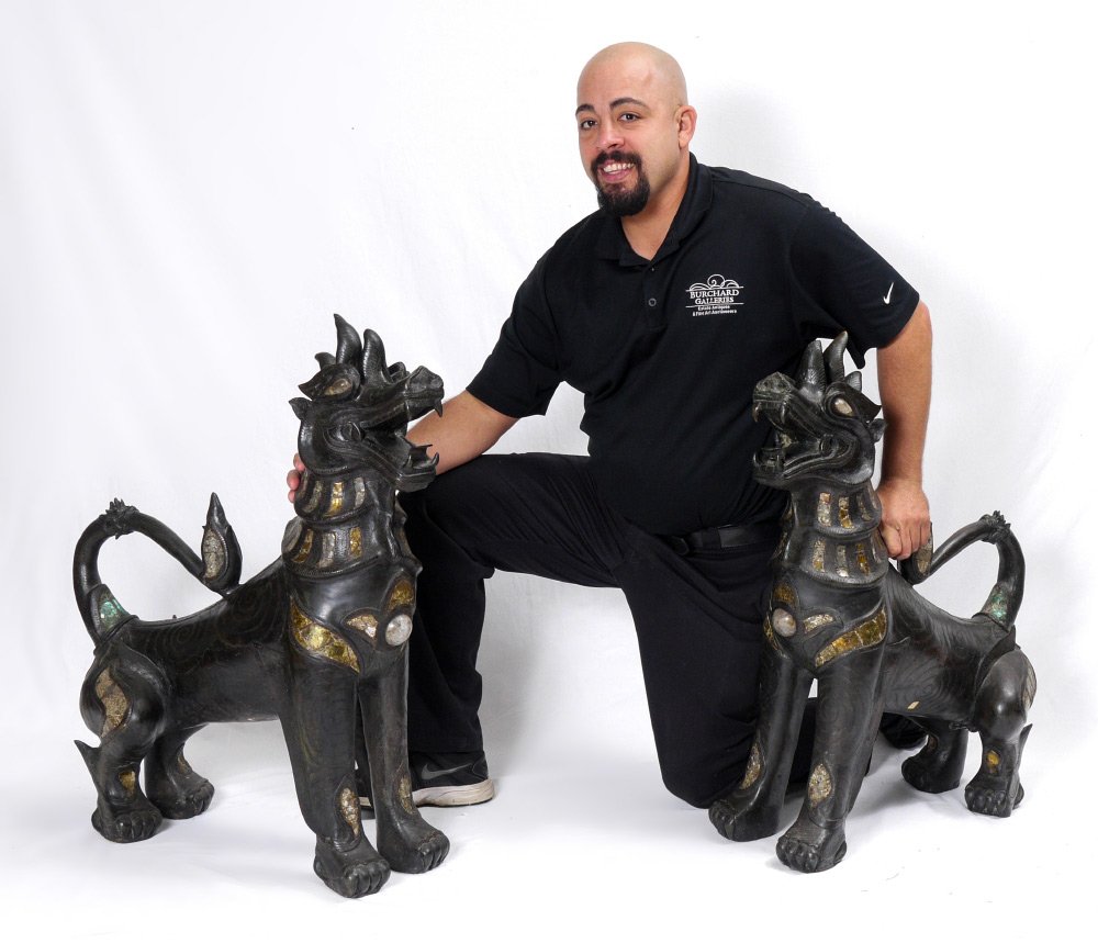 PAIR LARGE BRONZE TIBETAN TEMPLE LIONS: PAIR LARGE BRONZE TIBETAN TEMPLE LIONS: Similar, but not identical pair, each crouching forward with mouth agape. Each made of bronze with metal, mica and cabochon quartz jewel to breast bone, quartz 