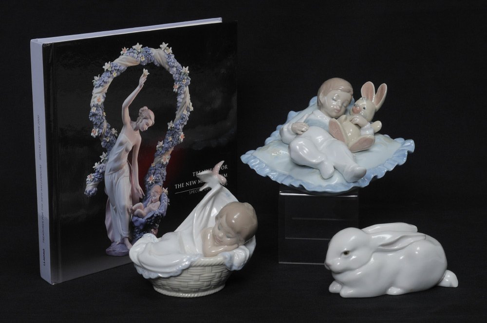 LLADRO PORCELAIN BABIES, BUNNIES & A BOOK: LLADRO PORCELAIN BABIES, BUNNIES & A BOOK: ''SLEEPING BUNNY'' #5904, Fulgencio Garcia sculptor, issued 1992 retired 1997, 2.25'' x 4.75''; ''TAKING A SNOOZZZE'' #6791, Jose Luis Alvarez sculptor, issu