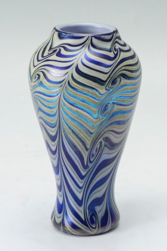 DURAND KING TUT ART GLASS VASE: DURAND KING TUT ART GLASS VASE: Iridescent pulled feather design, measures 7 1/2" tall.