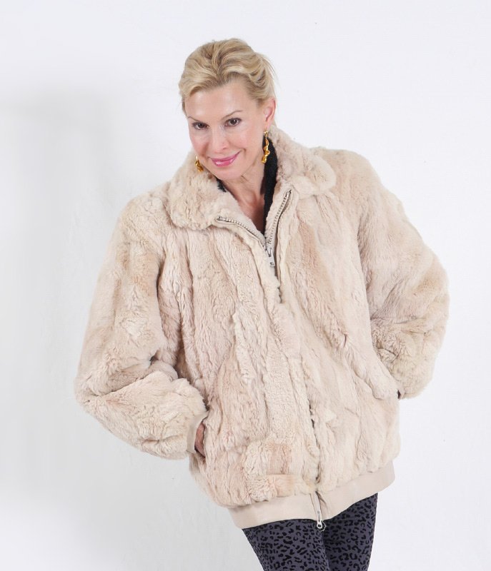 BLONDE LAMB FUR JACKET: BLONDE SHIRRED LAMB ZIPPERED JACKET: With matching leather trim cuffs and bottom edge band. Measures approx. 29" collar to hem, 20" shoulder to shoulder and 20" shoulder to cuff.