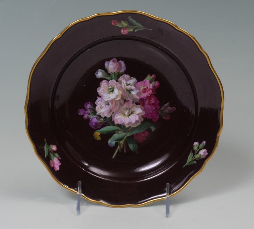 MEISSEN FLORAL HAND PAINTED CABINET PLATE: MEISSEN FLORAL HAND PAINTED CABINET PLATE: Scalloped gilt border, deep burgundy ground with hand painted floral decoration, back with underglaze blue crossed swords Meissen mark, 8 1/4