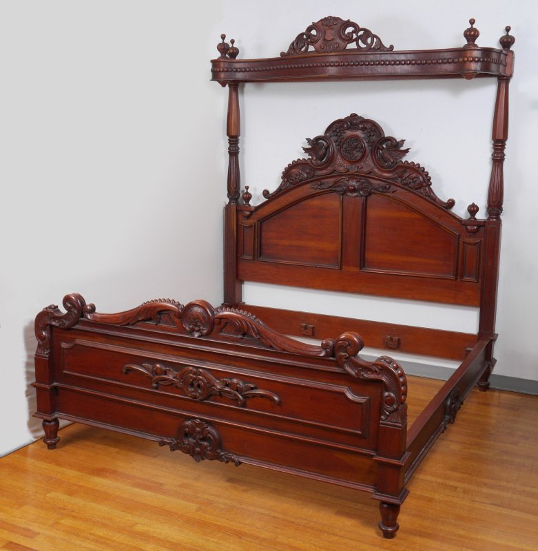 KING SIZE HALF TESTER CANOPY BED: KING SIZE HALF TESTER CANOPY BED: Contemporary half tester with carved and pierced upper, turned and fluted supports, headboard with figural birds, fruit, foliate scrolls. Foot board with central meda