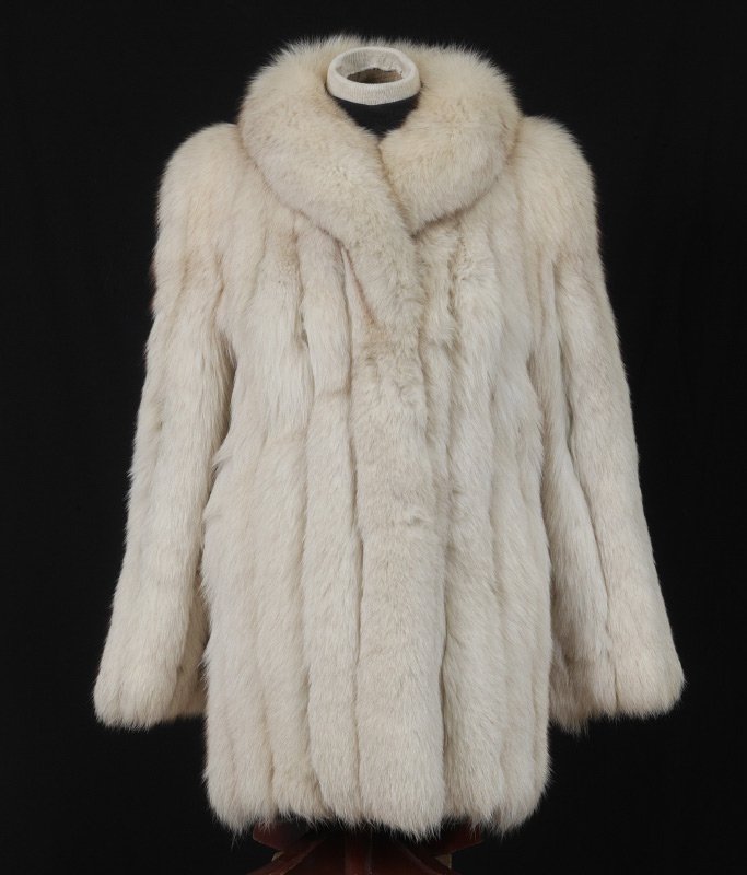 SAGA FOX JACKET: SAGA FOX LONG JACKET: Luxurious fur three quarter length coat, Saga Fox label. Measures approx. 30" collar to hem, 19" shoulder to shoulder and 22" sleeve.
