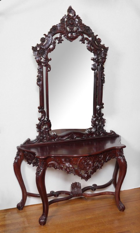 CARVED ROSEWOOD HALL TABLE WITH MIRROR: CARVED ROSEWOOD HALL TABLE WITH MIRROR: Contemporary piece, hall table with shaped top, profusely carved skirt, shaped legs, carved and shaped stretcher with center finial. Mirror profusely carved as 