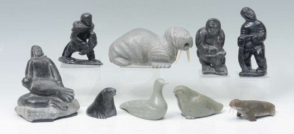 COLLECTION OF INUIT STONE CARVINGS: COLLECTION OF INUIT STONE CARVINGS: 9 pieces total to include Native Eskimo figures, walrus and birds. Largest figure measures 6 1/4" h. x 5 3/4" x 5 1/2".