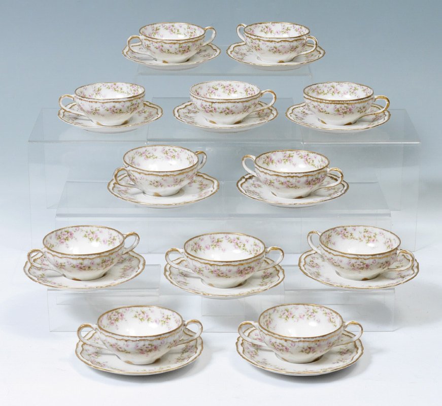 12 FRENCH HAVILAND LIMOGES BOUILLON CUPS SAUCERS: SET OF 12 FRENCH HAVILAND LIMOGES BOUILLON CUPS AND SAUCERS: Theodore Haviland, Ca. 1904-1920's. Rose decorated. 9 bouillon cups and 3 tea cups. Saucer measures 5 1/2" dia.
