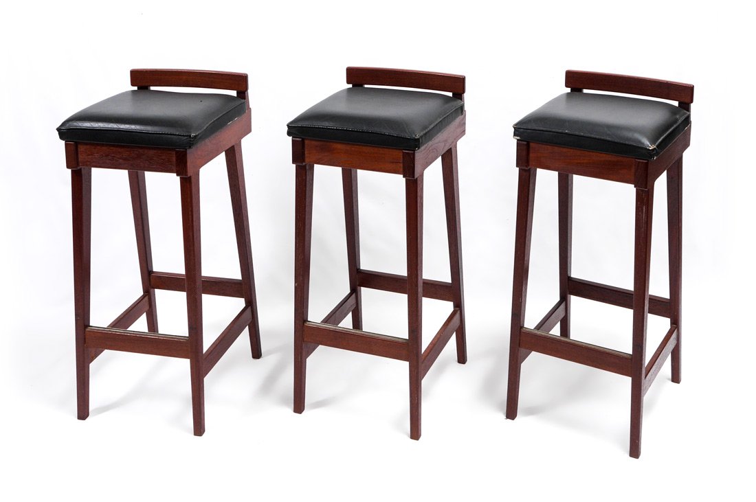 3 DYRLUND MID CENTURY DANISH STOOLS: 3 DYRLUND MID CENTURY DANISH STOOLS: Erik Buck for Dyrlund set of 3 rosewood stools with black leather seats, 32 1/4'' h. x 14'' x 15 1/2''.