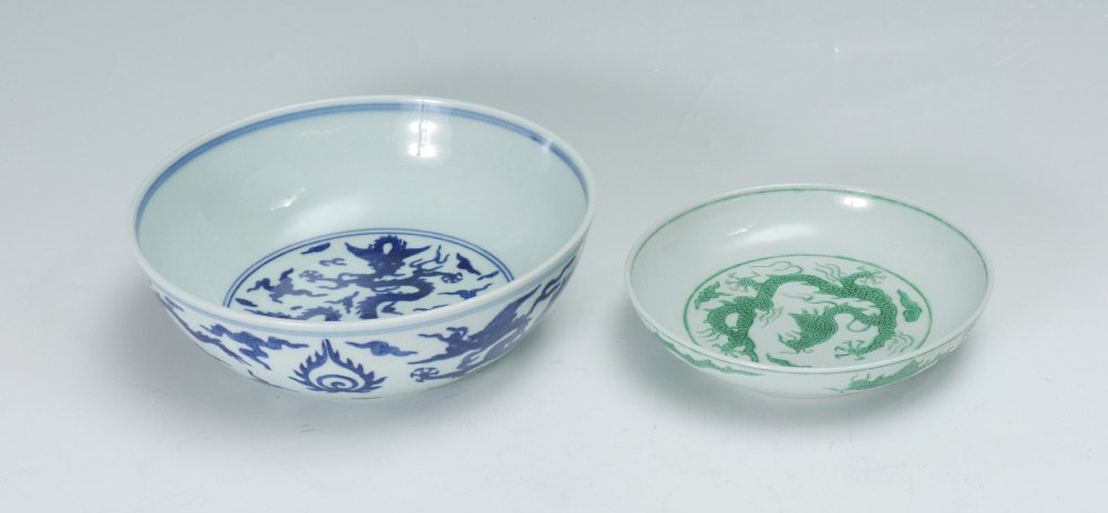 CHINESE GREEN DRAGON & BLUE DECORATED BOWLS: CHINESE GREEN DRAGON & BLUE DECORATED BOWLS: 2 pieces total, both bearing a Zhengde Reign Ming dynasty blue underglaze mark, to include 1) Green incised dragons on inside and out, 1 3/4" x 7". 2) Blue