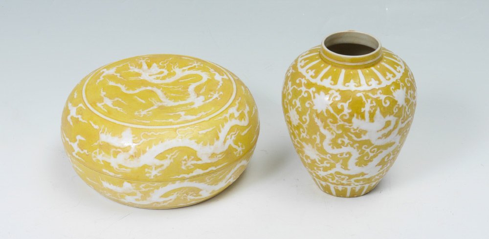 PAIR CHINESE YELLOW GLAZE VESSELS: PAIR CHINESE YELLOW GLAZE VESSELS: 2 pieces total, each bearing a Chenghua Reign, Ming Dynasty blue mark to include 1) Yellow ground with raised white dragon in clouds decoration, missing lid, 6" h. x