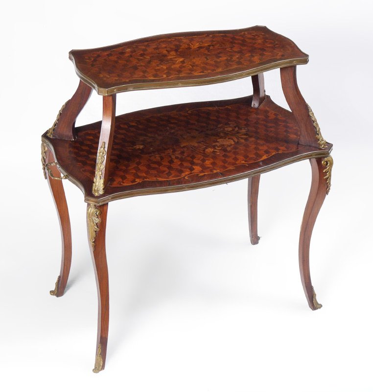 1900'S FRENCH PASTRY MARQUETRY DESSERT TABLE: 1900'S FRENCH PASTRY MARQUETRY DESSERT TABLE: 2 tier table with floral marquetry and parquetry inlay, shaped support with applied figural dolphin ormolu accents. Lower level with 2 handles. shaped leg