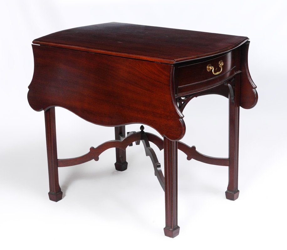 KINDEL WINTERTHUR COLLECTION MAHOGANY DROP LEAF TABLE: KINDEL WINTERTHUR COLLECTION MAHOGANY DROP LEAF TABLE: Double drop leaves with cookie corners, single drawer over fretwork decoration, shaped stretchers, fluted legs. 28 1/2" x 21" x 32". For a pair s