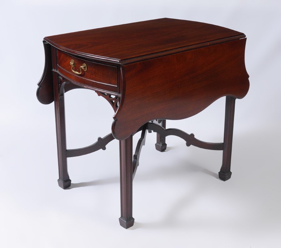 KINDEL WINTERTHUR COLLECTION MAHOGANY DROP LEAF TABLE: KINDEL WINTERTHUR COLLECTION MAHOGANY DROP LEAF TABLE: Double drop leaves with cookie corners, single drawer over fretwork decoration, shaped stretchers, fluted legs. 28 1/2" x 21" x 32". For a pair s