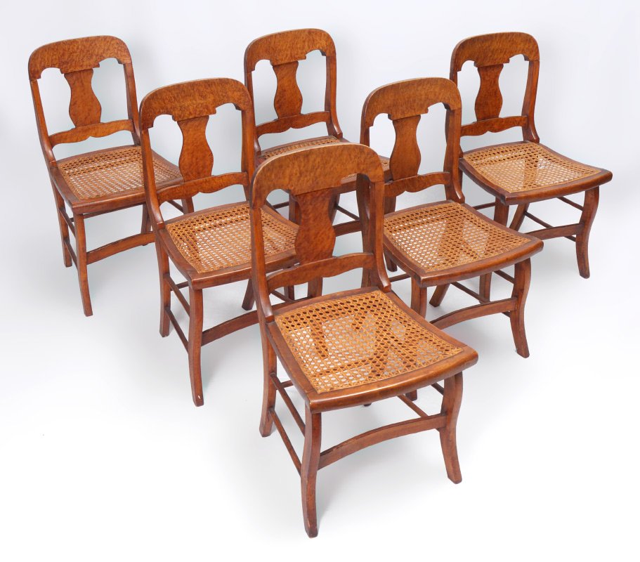 SET OF SIX BIRD'S-EYE MAPLE CANE SEAT CHAIRS: SET OF SIX BIRD'S-EYE MAPLE CANE SEAT CHAIRS: These adorable chairs have wide shaped crest rail over a baluster back splat, caned seats, saber legs with curved cross stretcher. 32.5"h. x 17"w. x 17"de