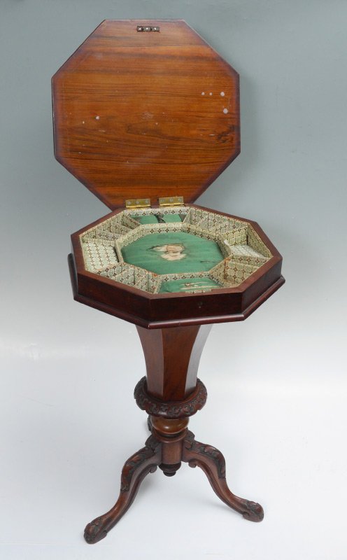VICTORIAN BURL WOOD OCTAGONAL TOP SEWING TABLE: VICTORIAN BURL WOOD OCTAGONAL TOP SEWING TABLE: Hinged top opens to fitted compartmented interior, flared octagonal support over carved and turned base, 3 carved legs. Overall 28 1/4" h. x 19".